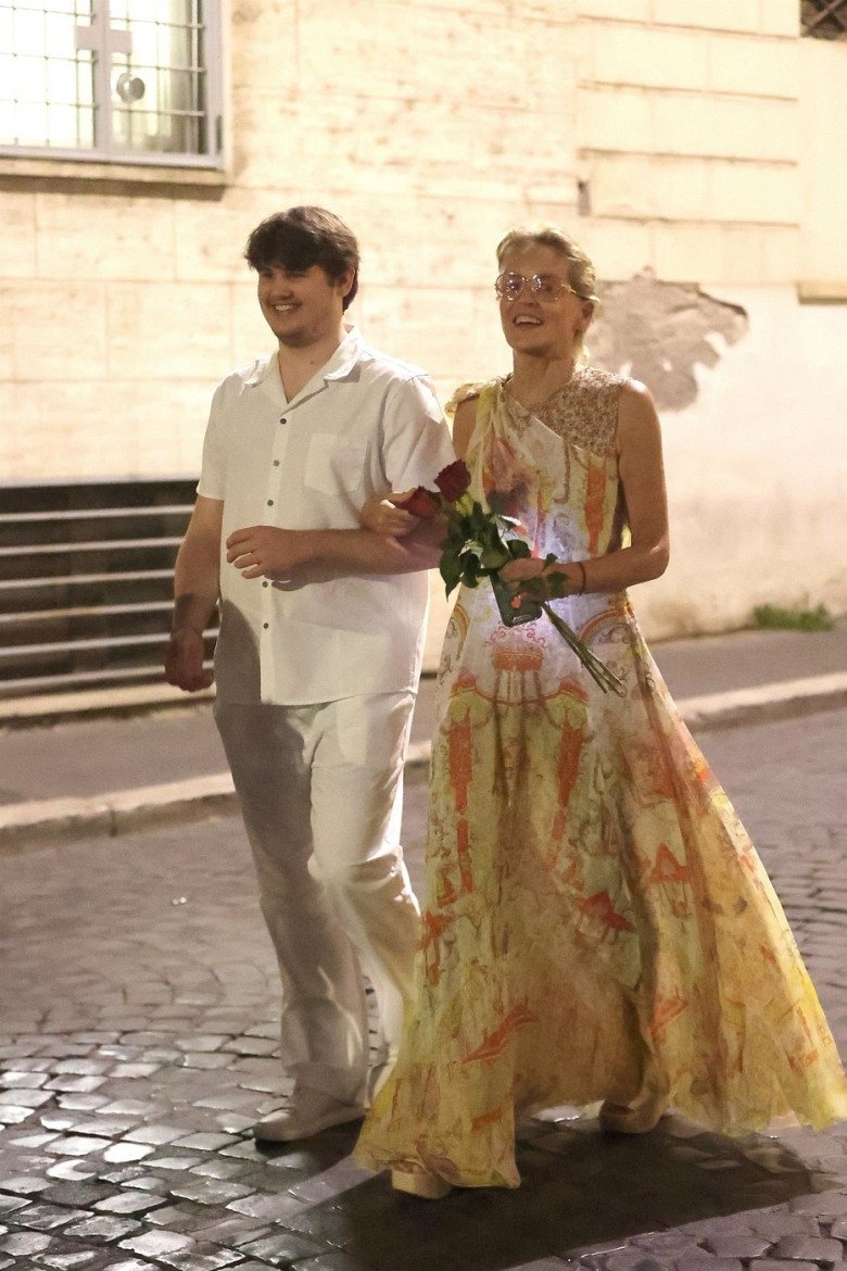 *EXCLUSIVE* The American Actress Sharon Stone looks in great spirits as she enjoys a spot of dinner with Gabriele Israilovici and son Laird at Dal Bolognese restaurant during a visit to the eternal city of Rome.