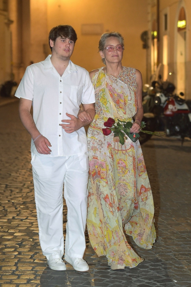 *EXCLUSIVE* The American Actress Sharon Stone looks in great spirits as she enjoys a spot of dinner with Gabriele Israilovici and son Laird at Dal Bolognese restaurant during a visit to the eternal city of Rome.