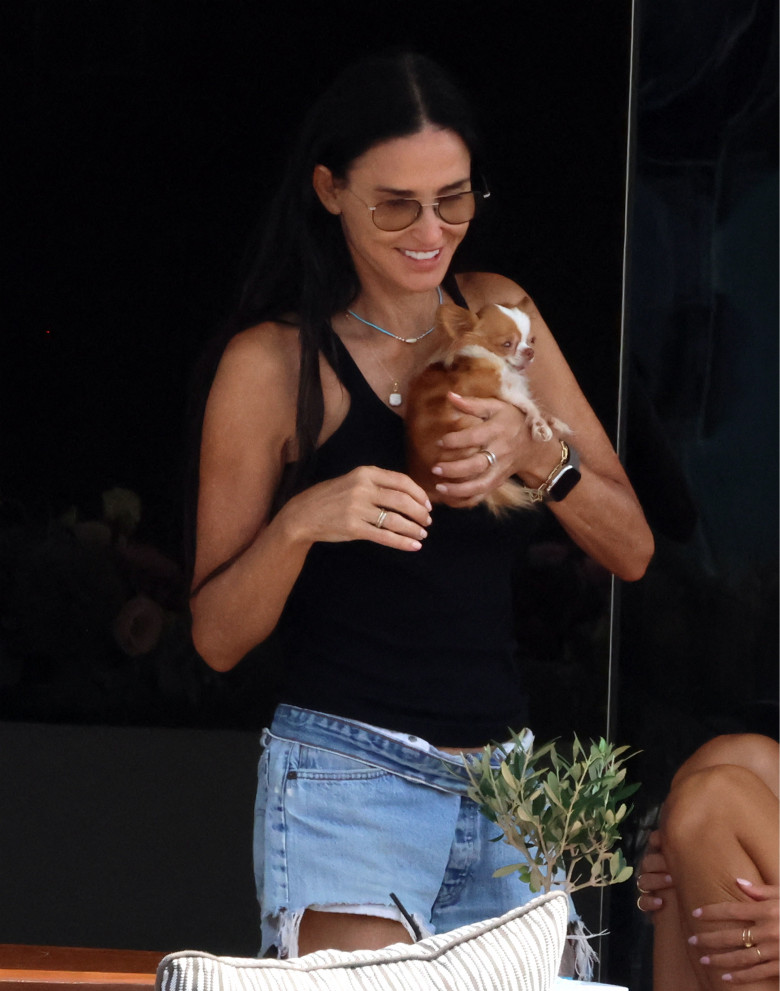 EXCLUSIVE: Demi Moore with her pet pup Pilaf while vacationing in Greece.