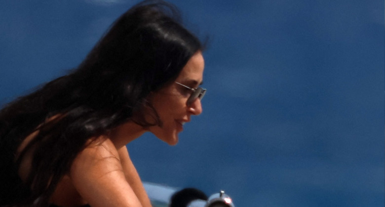 EXCLUSIVE: Demi Moore with her pet pup Pilaf while vacationing in Greece.