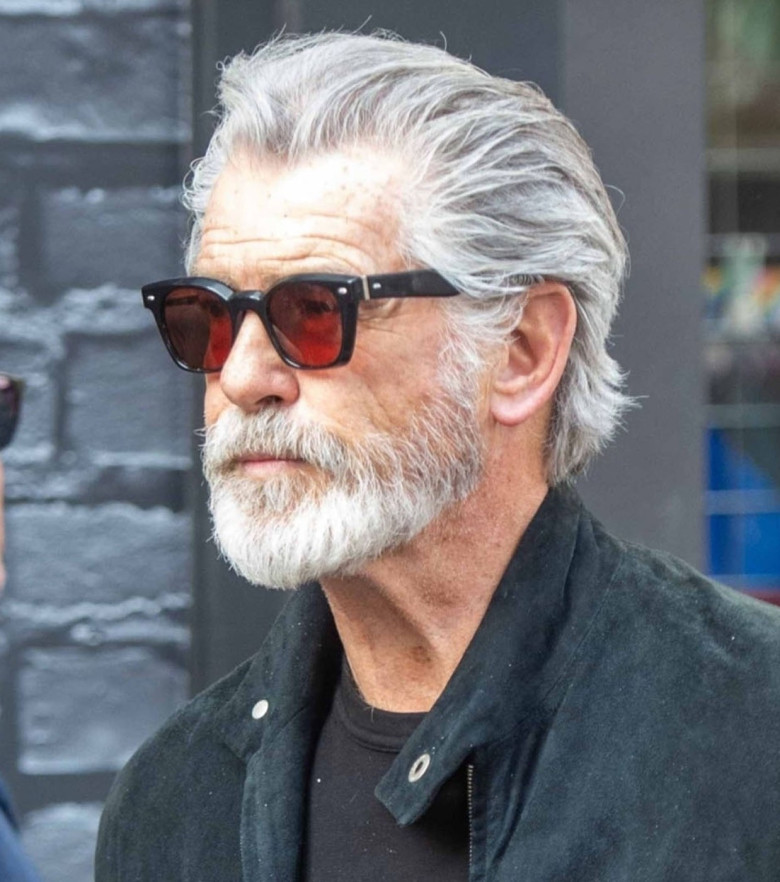 *PREMIUM-EXCLUSIVE* *MUST CALL FOR PRICING* The 'Silver Fox', James Bond's Pierce Brosnan takes a short cut through London's red light district in London's Soho after dining at the Groucho Club with friends.