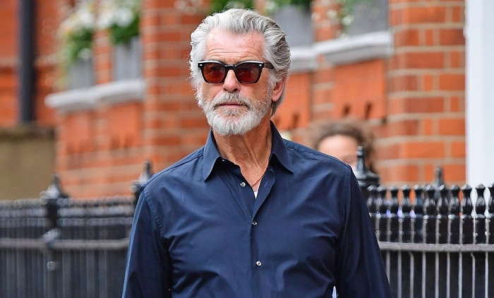 *EXCLUSIVE* The Silver Fox and a rather suave looking Pierce Brosnan looks cool in his sunglasses as the James Bond star is spotted out on a stroll in London's Chelsea.