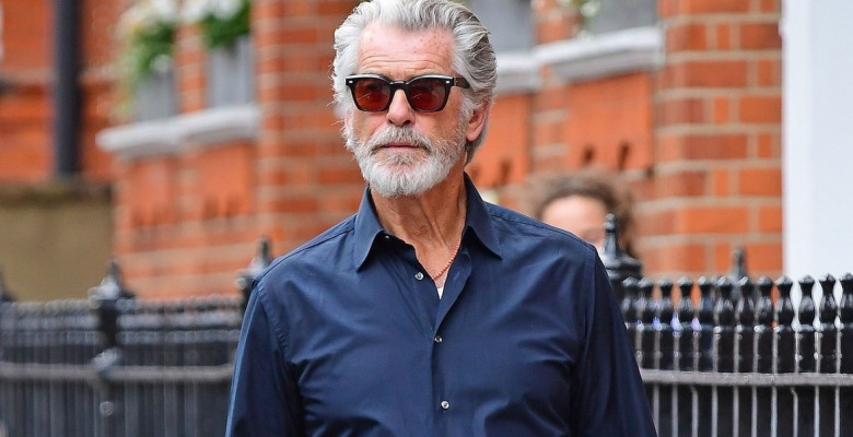 *EXCLUSIVE* The Silver Fox and a rather suave looking Pierce Brosnan looks cool in his sunglasses as the James Bond star is spotted out on a stroll in London's Chelsea.