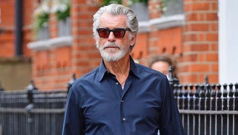 *EXCLUSIVE* The Silver Fox and a rather suave looking Pierce Brosnan looks cool in his sunglasses as the James Bond star is spotted out on a stroll in London's Chelsea.