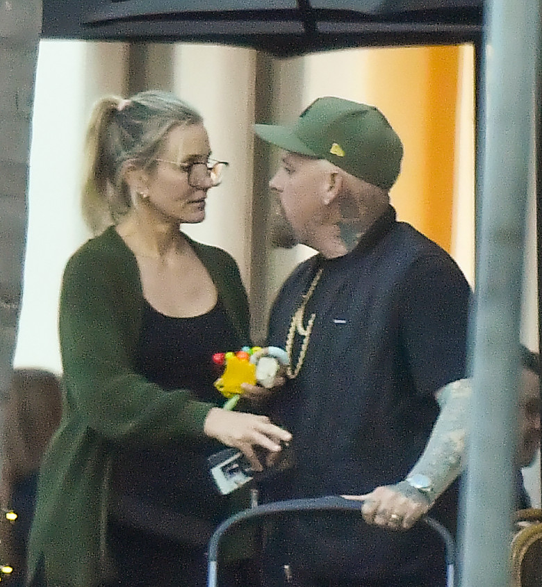 EXCLUSIVE: Cameron Diaz and husband Benji Madden share a sweet kiss as they leave a restaurant in Montecito Ca