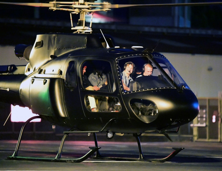 *EXCLUSIVE* WEB MUST CALL FOR PRICING  - Piloting a few friends on his chopper, The American All Action Hero Tom Cruise proves he has many strings to his bow by taking a few snaps of his guests as he arrived at the Battersea Heliport.