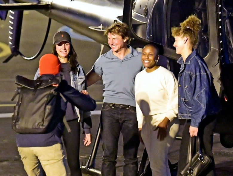 *EXCLUSIVE* WEB MUST CALL FOR PRICING  - Piloting a few friends on his chopper, The American All Action Hero Tom Cruise proves he has many strings to his bow by taking a few snaps of his guests as he arrived at the Battersea Heliport.