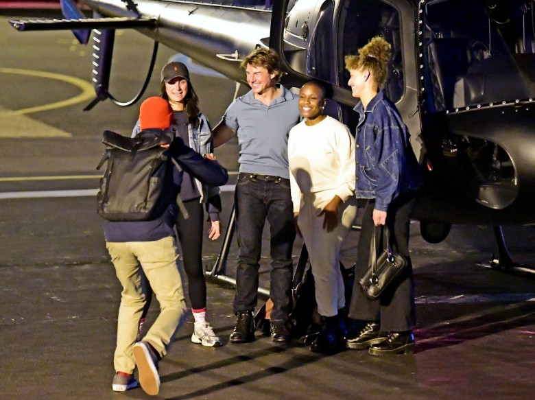 *EXCLUSIVE* WEB MUST CALL FOR PRICING  - Piloting a few friends on his chopper, The American All Action Hero Tom Cruise proves he has many strings to his bow by taking a few snaps of his guests as he arrived at the Battersea Heliport.