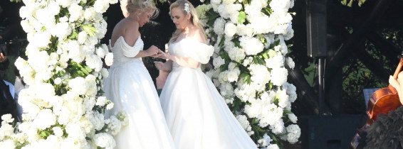 *PREMIUM-EXCLUSIVE* *MUST CALL FOR PRICING * Australian actress Rebel Wilson and her fashion designer fiancée Ramona Agruma look stunning in white wedding dresses as the couple are married in a beautiful ceremony at the Hotel Cala di Volpe in Sardinia