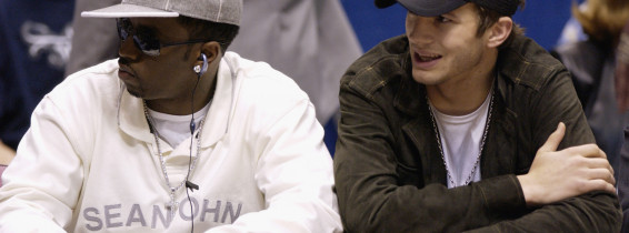 Sean "P. Diddy" Combs and Ashton Kutcher sit courtside