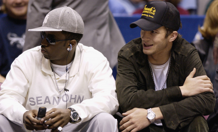 Sean "P. Diddy" Combs and Ashton Kutcher sit courtside