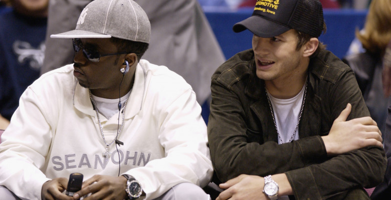 Sean "P. Diddy" Combs and Ashton Kutcher sit courtside