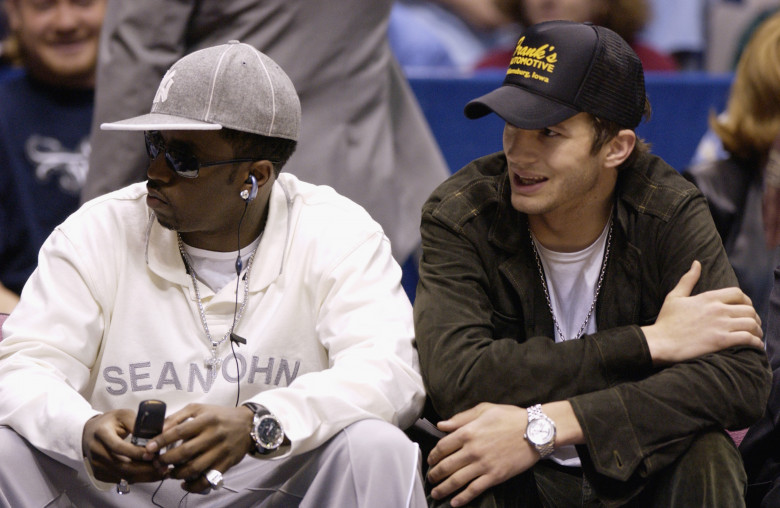 Sean "P. Diddy" Combs and Ashton Kutcher sit courtside