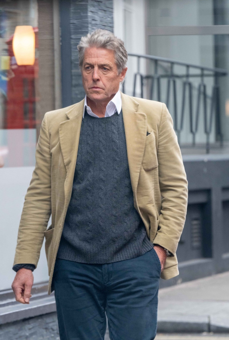 *EXCLUSIVE* Silver Fox Hugh Grant lets it all hang out on a trip to Soho (well his tongue that is!)