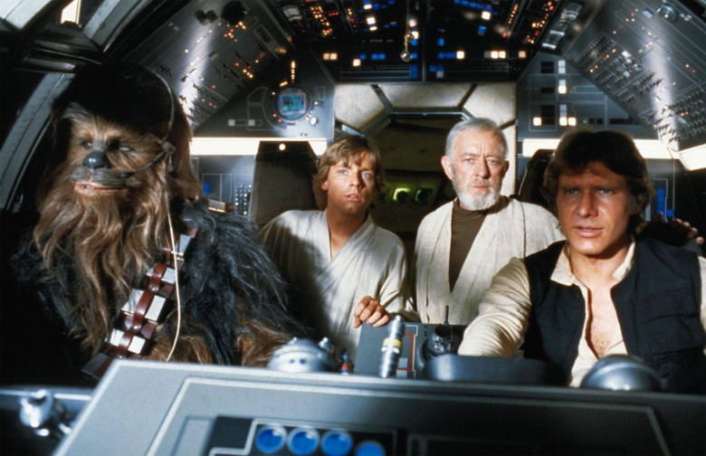 STAR WARS EPISODE IV - A NEW HOPE 1977 20th Century Fox sci-fi film with from left: Peter Mayhew ( Chewbacca), Mark Hamill(Luke Skywalker), Alec Guinness  (Obi-Wan Kenobi), Harrison Ford (han Solo)