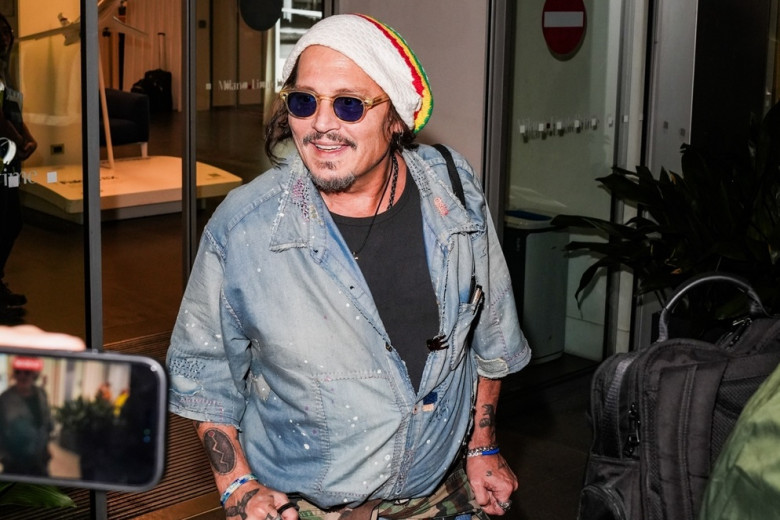 Johnny Depp steps out the Milan airport after the Rome film festival before a TV interview on channel 9