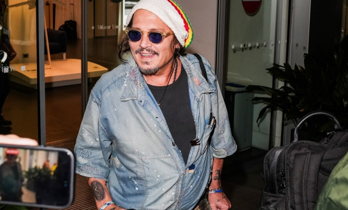 Johnny Depp steps out the Milan airport after the Rome film festival before a TV interview on channel 9