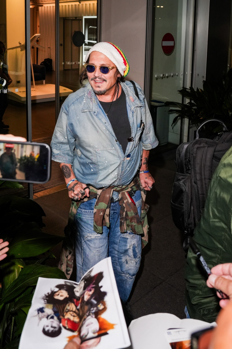 Johnny Depp steps out the Milan airport after the Rome film festival before a TV interview on channel 9