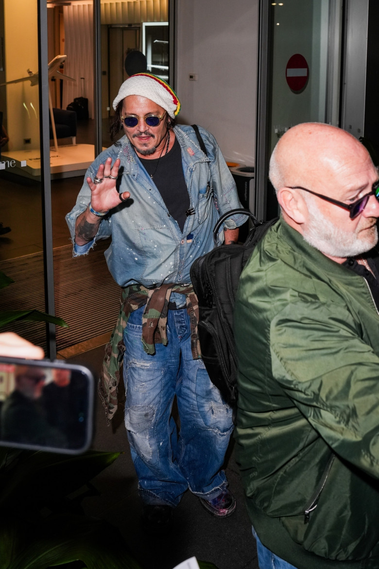 Johnny Depp steps out the Milan airport after the Rome film festival before a TV interview on channel 9