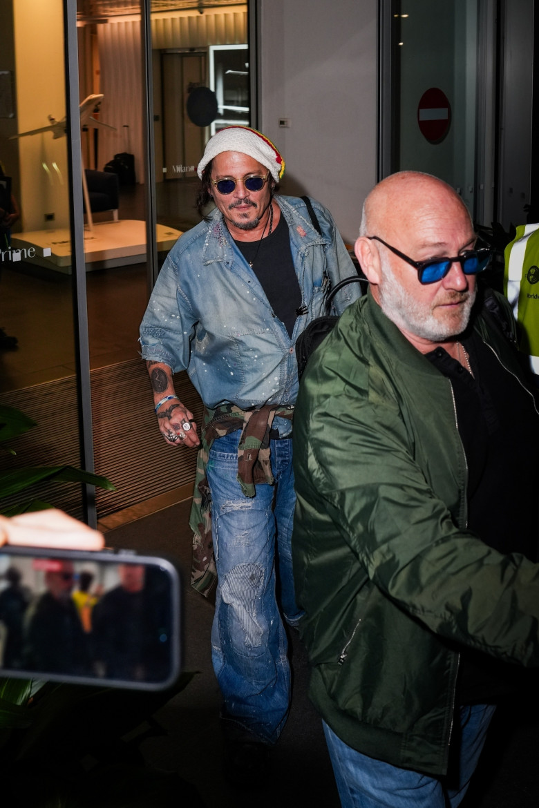 Johnny Depp steps out the Milan airport after the Rome film festival before a TV interview on channel 9