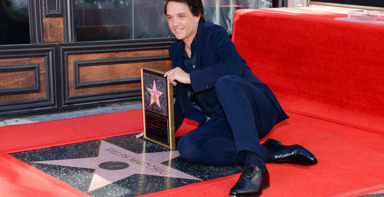 Ralph Macchio poses with his new star on the Hollywood Walk of Fame on November 20, 2024 in Hollywood, California.