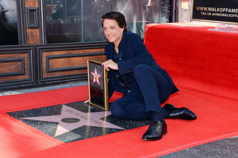 Ralph Macchio poses with his new star on the Hollywood Walk of Fame on November 20, 2024 in Hollywood, California.