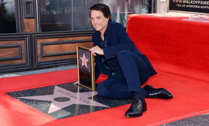 Ralph Macchio poses with his new star on the Hollywood Walk of Fame on November 20, 2024 in Hollywood, California.