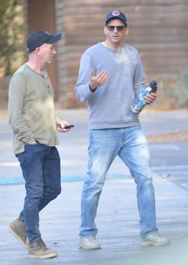 EXCLUSIVE: Ashton Kutcher looks downcast during a hike with a pal as divorce rumors swirl amid Diddy's sex trafficking case.