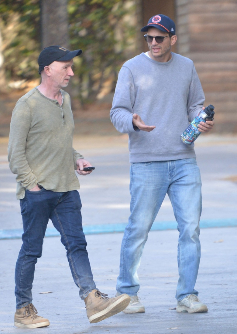 EXCLUSIVE: Ashton Kutcher looks downcast during a hike with a pal as divorce rumors swirl amid Diddy's sex trafficking case.