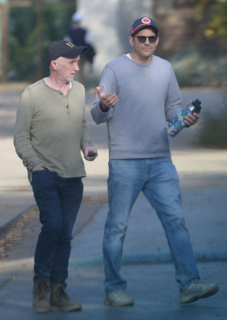 EXCLUSIVE: Ashton Kutcher looks downcast during a hike with a pal as divorce rumors swirl amid Diddy's sex trafficking case.