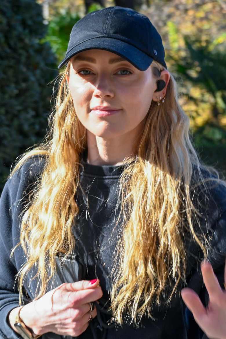 American actress Amber Heard is all smiles while out jogging in Madrid after announcing she is expecting her second child