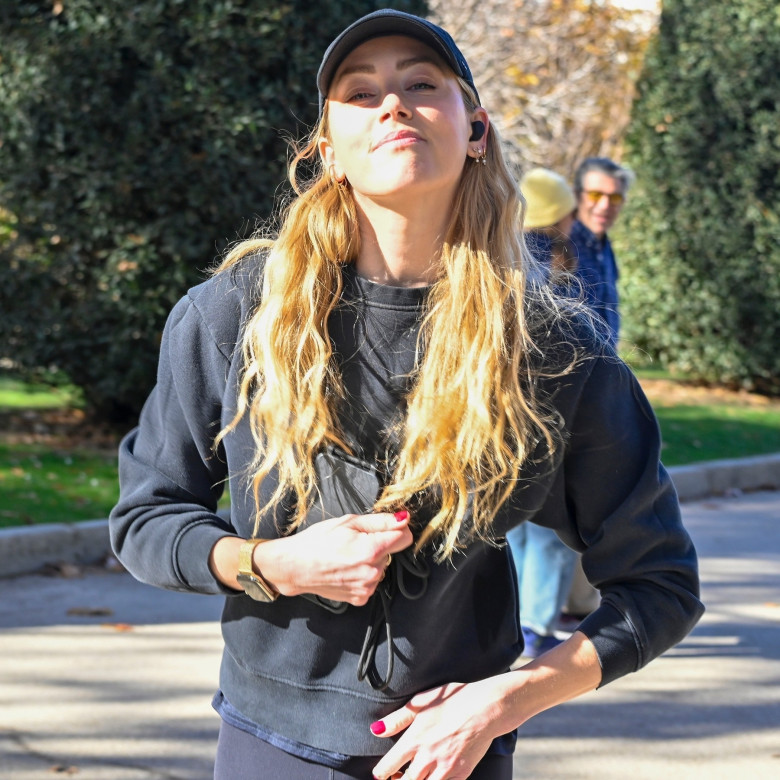 American actress Amber Heard is all smiles while out jogging in Madrid after announcing she is expecting her second child