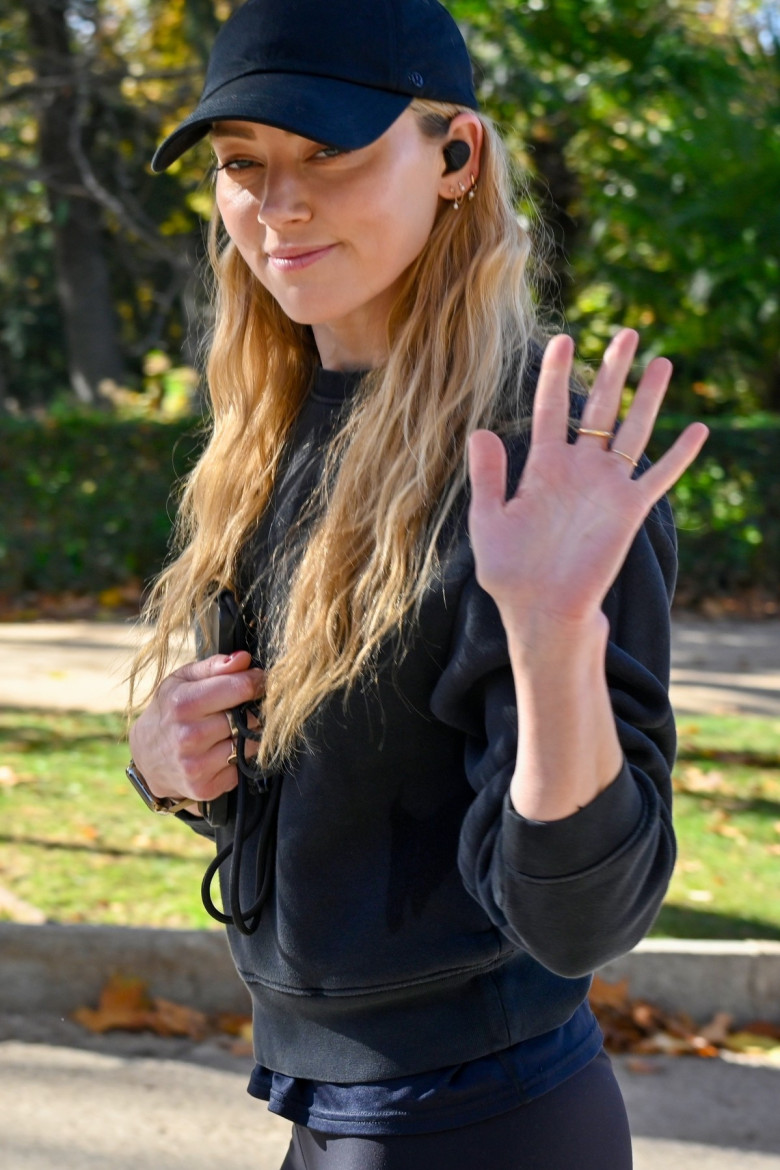 American actress Amber Heard is all smiles while out jogging in Madrid after announcing she is expecting her second child