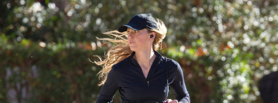 American actress Amber Heard is all smiles while out jogging in Madrid after announcing she is expecting her second child