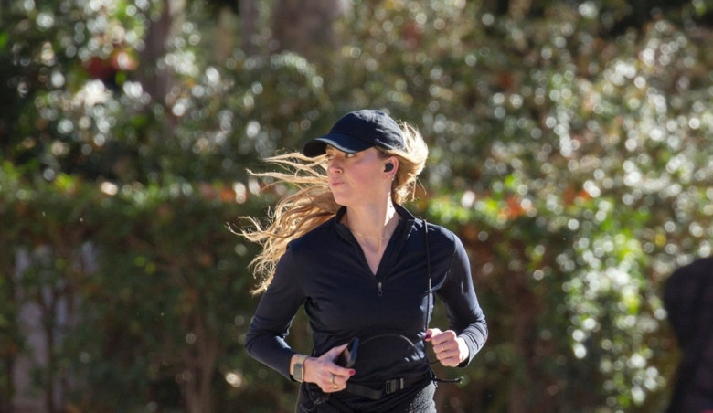 American actress Amber Heard is all smiles while out jogging in Madrid after announcing she is expecting her second child