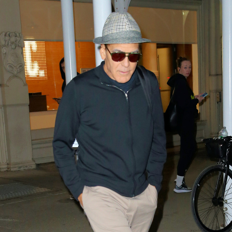 George Clooney cuts a youthful figure in a fedora after rehearsal for 'Good Night and Good Luck' in New York City