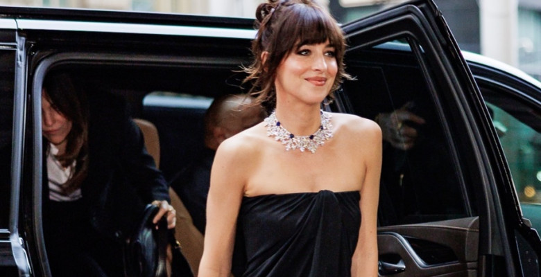 Dakota Johnson exudes elegance in a black Ferragamo dress at the Global Ambassadorship Celebration in NYC