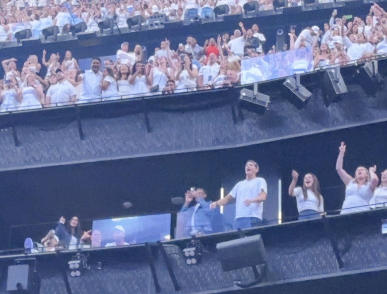 Ashton Kutcher and Mila Kunis at the Backstreet Boys concert