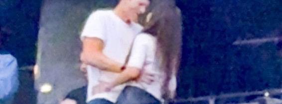 Ashton Kutcher and Mila Kunis at the Backstreet Boys concert