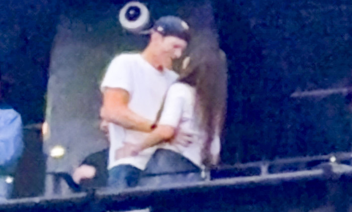 Ashton Kutcher and Mila Kunis at the Backstreet Boys concert