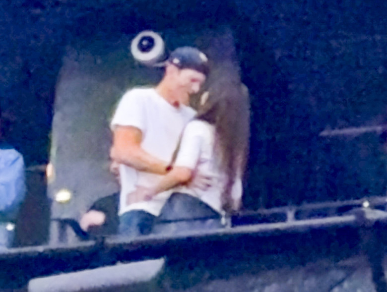 Ashton Kutcher and Mila Kunis at the Backstreet Boys concert