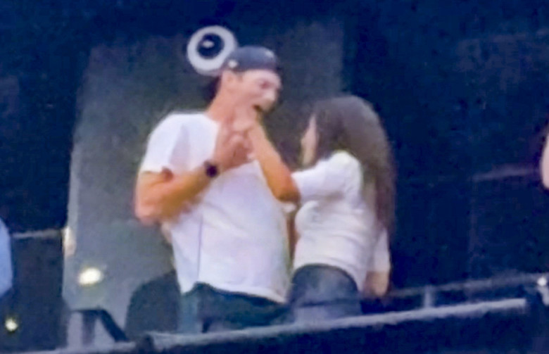Ashton Kutcher and Mila Kunis at the Backstreet Boys concert