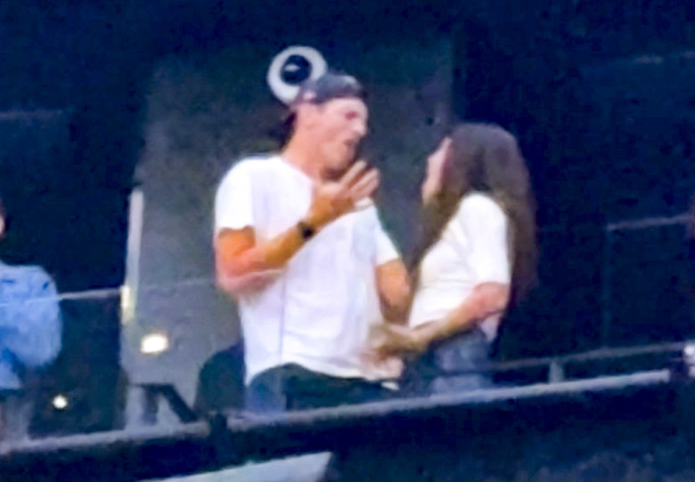 Ashton Kutcher and Mila Kunis at the Backstreet Boys concert