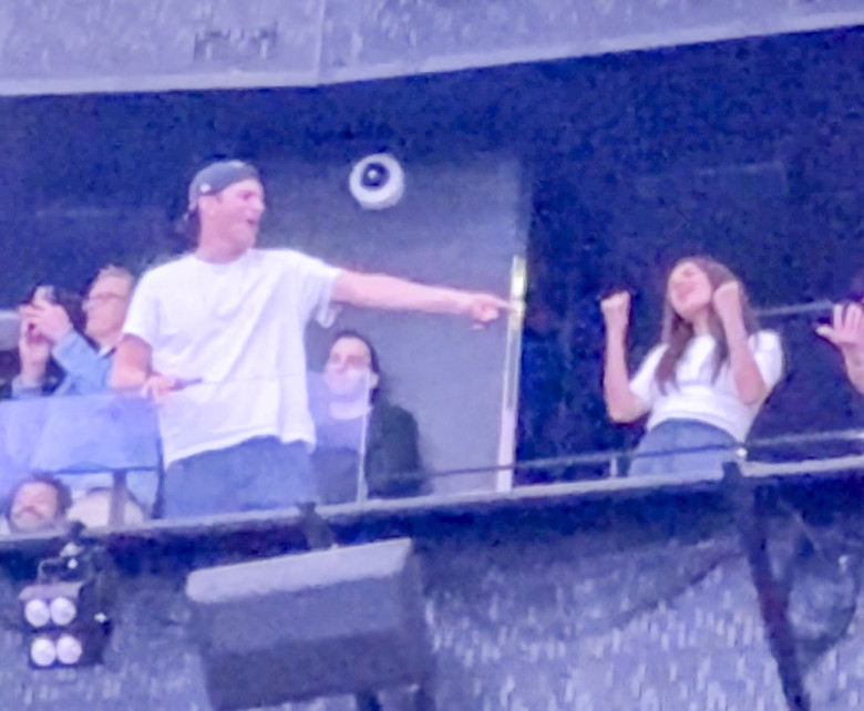Ashton Kutcher and Mila Kunis at the Backstreet Boys concert