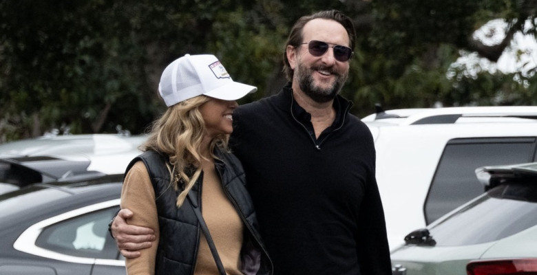 EXCLUSIVE: ** NO DAILY MAIL ON LINE ** Christine Baumgartner flashes her engagement ring during an outing with Josh Connor.
