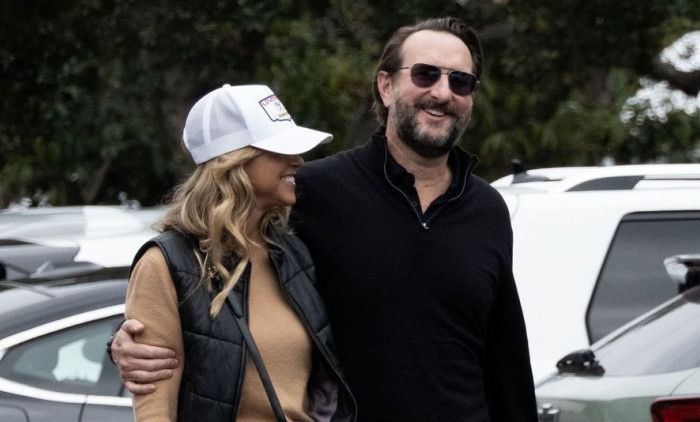 EXCLUSIVE: ** NO DAILY MAIL ON LINE ** Christine Baumgartner flashes her engagement ring during an outing with Josh Connor.