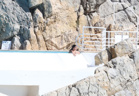Michelle Rodriguez takes in the French sunshine as she relaxes by the pool at the Cap Eden Roc hotel during 79th Cannes Film Festival.