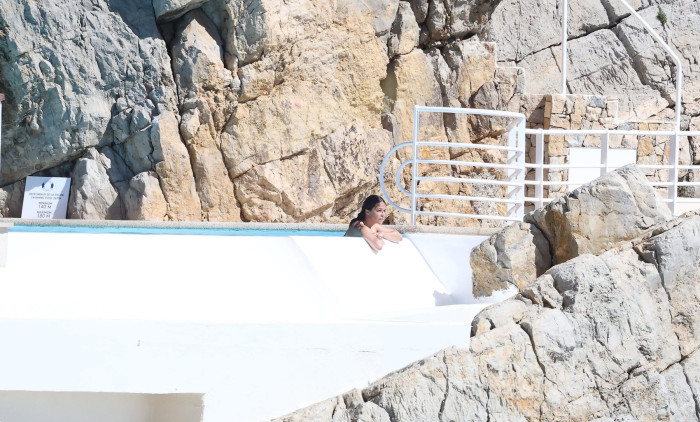 Michelle Rodriguez takes in the French sunshine as she relaxes by the pool at the Cap Eden Roc hotel during 79th Cannes Film Festival.