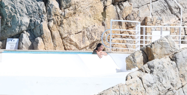 Michelle Rodriguez takes in the French sunshine as she relaxes by the pool at the Cap Eden Roc hotel during 79th Cannes Film Festival.
