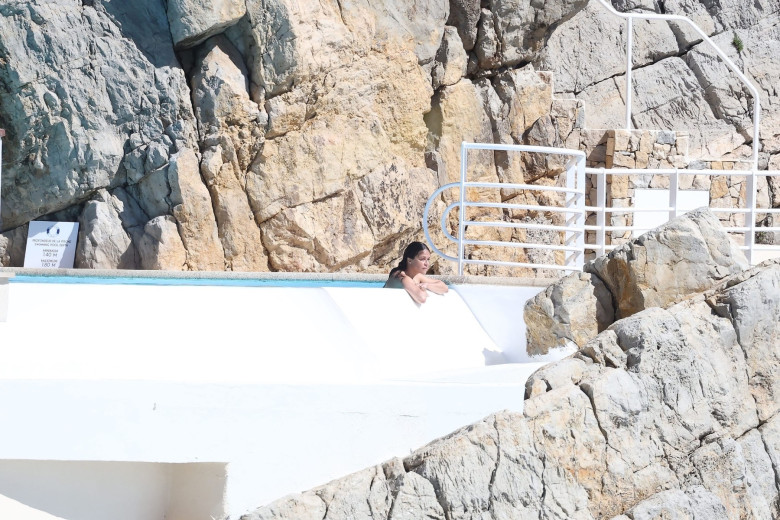 Michelle Rodriguez takes in the French sunshine as she relaxes by the pool at the Cap Eden Roc hotel during 79th Cannes Film Festival.
